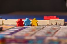 Meeples on a board